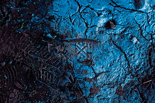 Soggy Cracked Mud Face Smirking (Blue Tint Photo)