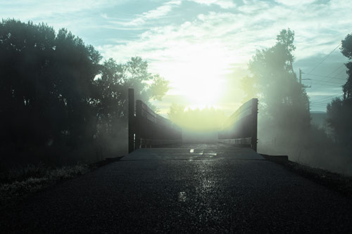 Sun Rises Beyond Foggy Wooden Walkway Bridge (Blue Tint Photo)