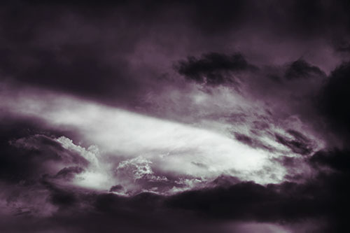 White Light Tearing Through Clouds (Blue Tint Photo)