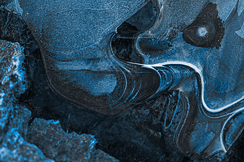 Angry Fuming Frozen River Ice Face (Blue Tone Photo)