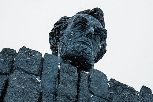 Blowing Snow Across Presidential Statue Head (Blue Tone Photo)