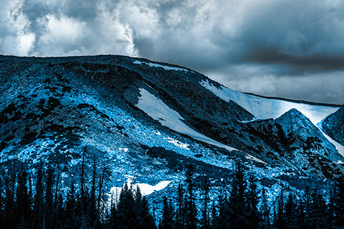 Clouds Cover Melted Snowy Mountain Range (Blue Tone Photo)