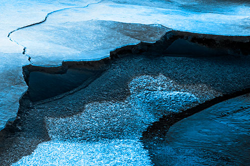 Cracked Ice Frozen Shoreline Melting (Blue Tone Photo)