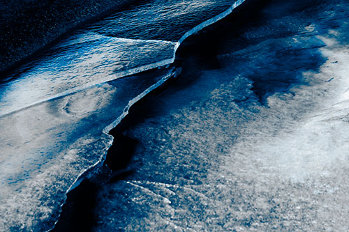 Cracking Blood Frozen Ice River (Blue Tone Photo)