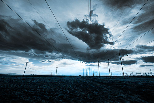 Creature Cloud Formation Above Powerlines (Blue Tone Photo)