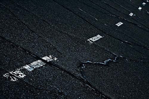 Decomposing Pavement Markings Along Sidewalk (Blue Tone Photo)