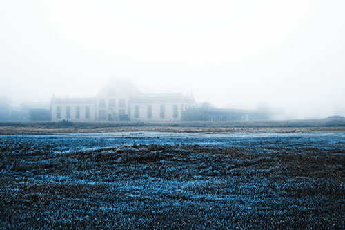 Dense Fog Consumes Distant Historic State Penitentiary (Blue Tone Photo)