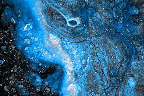 Distressed Oil Face Swirling Among Rocky Shore (Blue Tone)