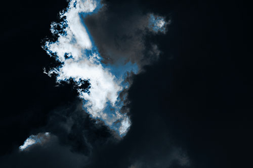 Evil Cloud Face Snarls Among Sky (Blue Tone Photo)