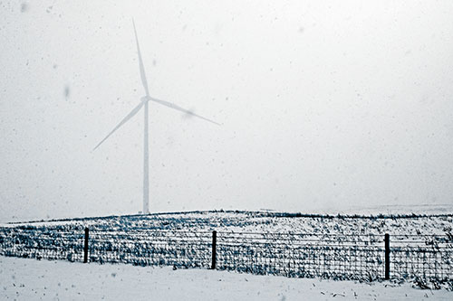 Fenced Wind Turbine Among Blowing Snow (Blue Tone)