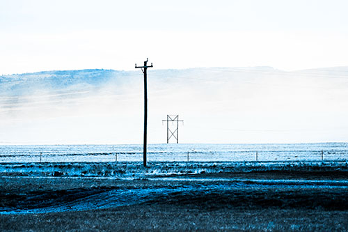 Heavy Fog Hiding Mountain Range Behind Powerlines (Blue Tone Photo)
