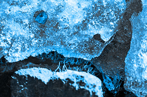 Ice Melting Crevice Mouthed Rock Face (Blue Tone Photo)