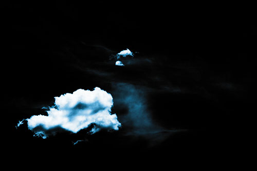 Isolated Creature Head Cloud Appears Within Darkness (Blue Tone Photo)