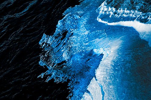 Melting Ice Face Creature Atop River Water (Blue Tone Photo)