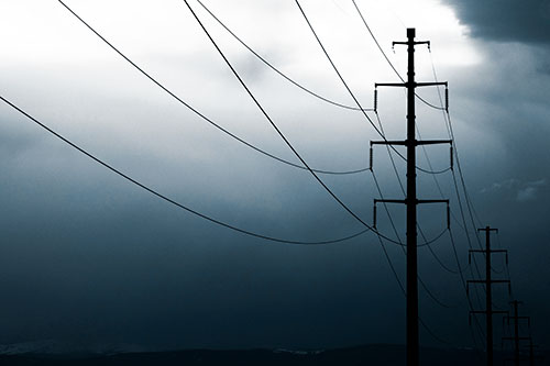 Powerlines Receding Into Thunderstorm (Blue Tone Photo)
