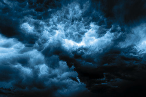 Raging Thunderstorm Clouds Brewing Among Sky (Blue Tone)