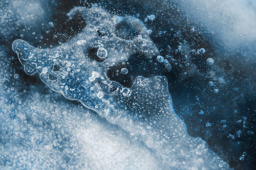 Screaming Submerged Bubble Face Creature Among Icy River (Blue Tone)