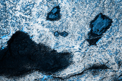 Shocked Puddle Face Drying Among Rock Surface (Blue Tone Photo)