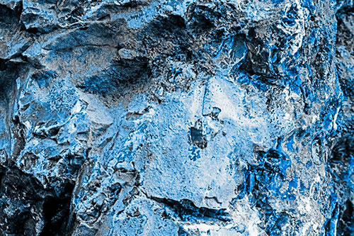 Shut Eyed Rock Face Decomposing (Blue Tone Photo)