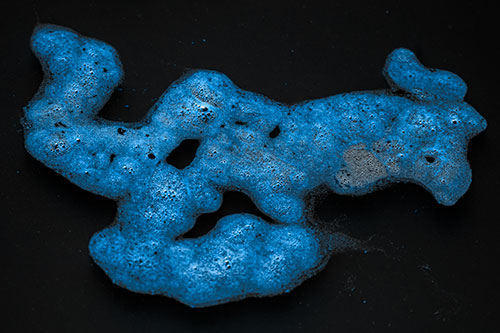 Sorrow Morphing Bubble Face Floating Above Soil (Blue Tone)