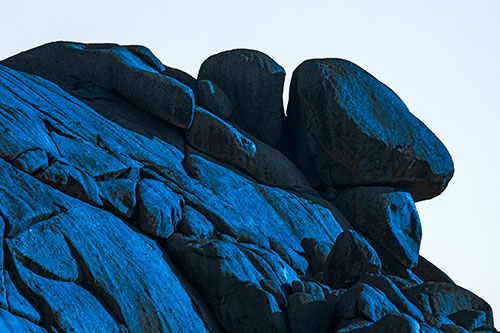 Sunlight Casting Shadows On Mountain Of Rocks (Blue Tone Photo)