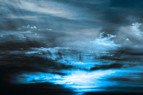 Sunrise Bursting Colorful Light Past Clouds (Blue Tone Photo)