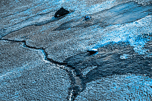 Three Ice Melting Puddles (Blue Tone Photo)