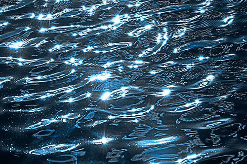 Water Ripples Sparkling Among Sunlight (Blue Tone Photo)