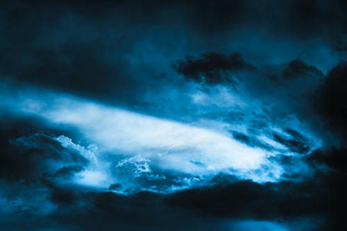 White Light Tearing Through Clouds (Blue Tone Photo)