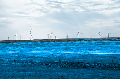 Wind Turbines Scattered Along Prairie Horizon (Blue Tone)