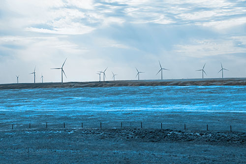 Wind Turbines Scattered Along The Prairie Horizon (Blue Tone Photo)