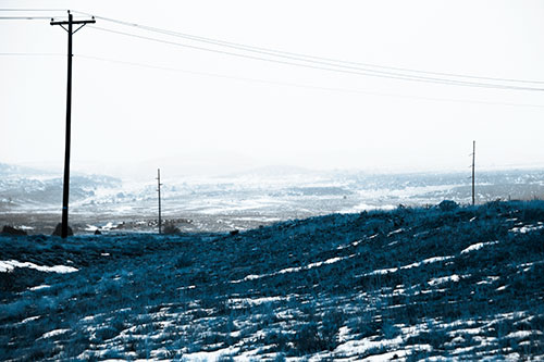 Winter Snowstorm Approaching Powerlines (Blue Tone Photo)