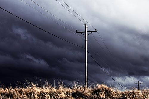 Dark Thunderstorm Clouds Over Powerline