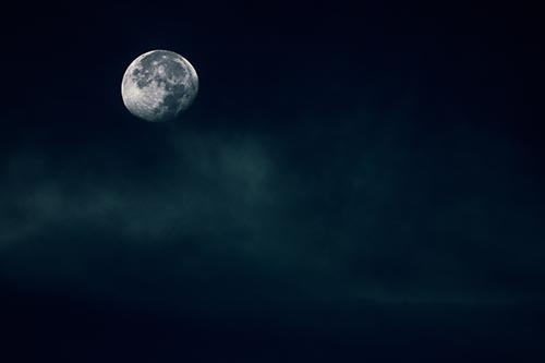 Moon Begins Descent Beyond Faint Mist Cloud