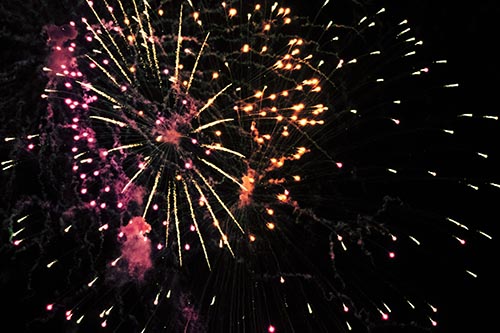 Multiple Firework Explosions Send Light Orbs Flying