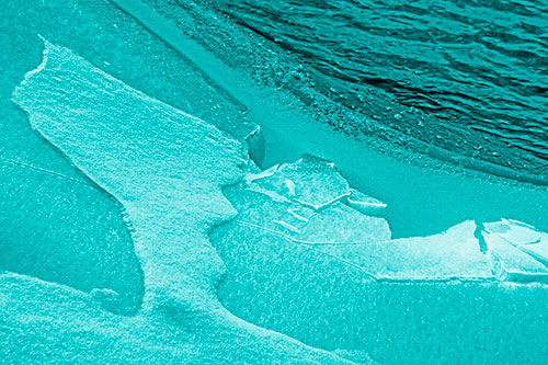 Broken Cracked Ice Along Shoreline (Cyan Shade Photo)