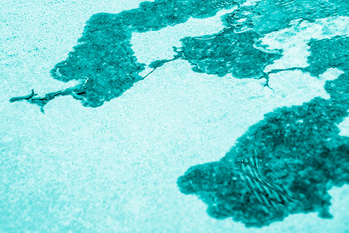 Creeping Water Puddle Across Concrete (Cyan Shade Photo)