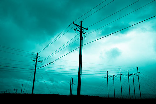 Crossing Powerlines Beneath Rainstorm (Cyan Shade Photo)