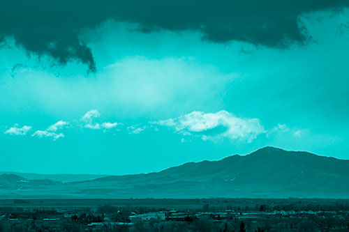 Dark Cloud Mass Above Mountain Range Horizon (Cyan Shade Photo)