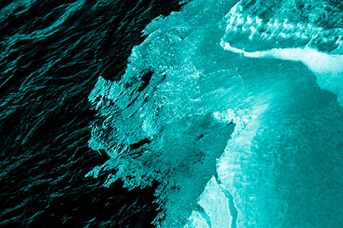 Melting Ice Face Creature Atop River Water (Cyan Shade Photo)