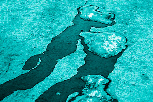 Melting Ice Puddles Forming Water Streams (Cyan Shade Photo)