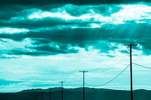 Powerline Silhouette Entering Mountain Range (Cyan Shade Photo)