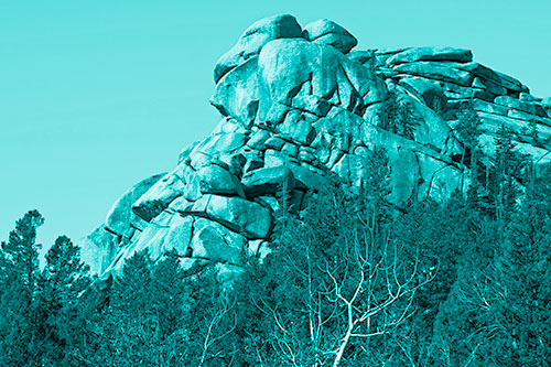 Rock Formations Rising Above Treeline (Cyan Shade Photo)