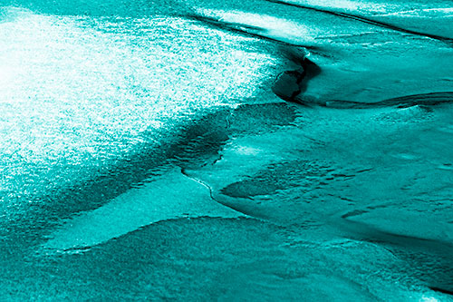 Sloping Ice Melting Atop River Water (Cyan Shade Photo)