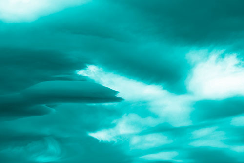 Smooth Cloud Sails Along Swirling Formations (Cyan Shade Photo)
