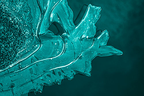 Smooth Ice Face Creature Hanging Above River Shoreline (Cyan Shade Photo)