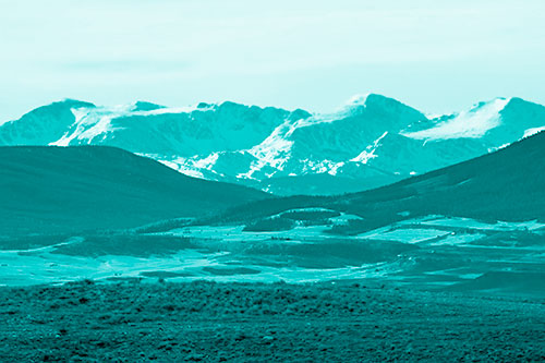 Snow Capped Mountains Behind Hills (Cyan Shade Photo)