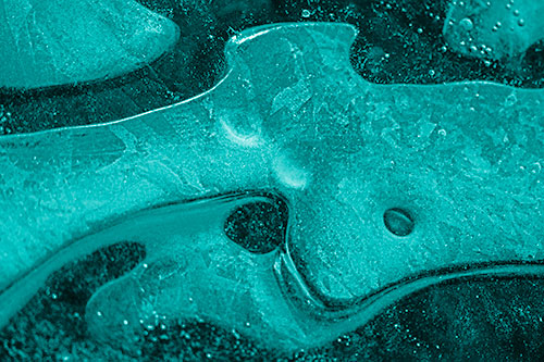 Swirling Frozen Smiling Bubble Eyed River Ice Face (Cyan Shade Photo)