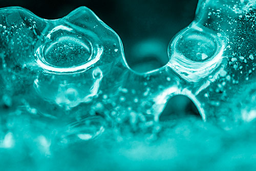 Vertical Bubble Eyed Screaming Ice Face Along Frozen River (Cyan Shade Photo)