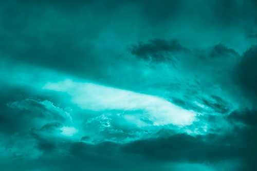 White Light Tearing Through Clouds (Cyan Shade Photo)